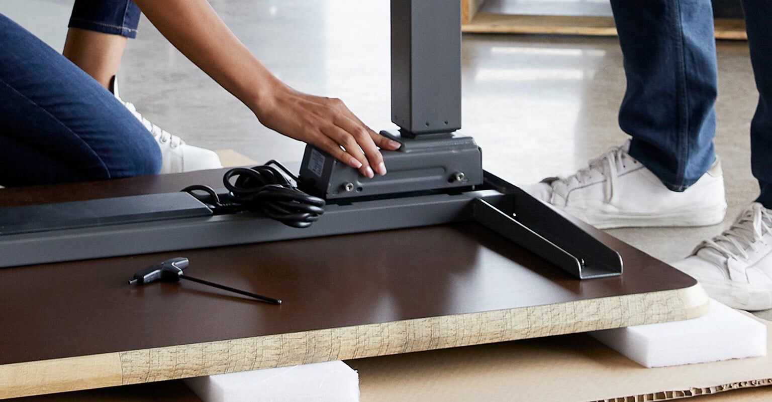 vari electric standing desk being assembled
